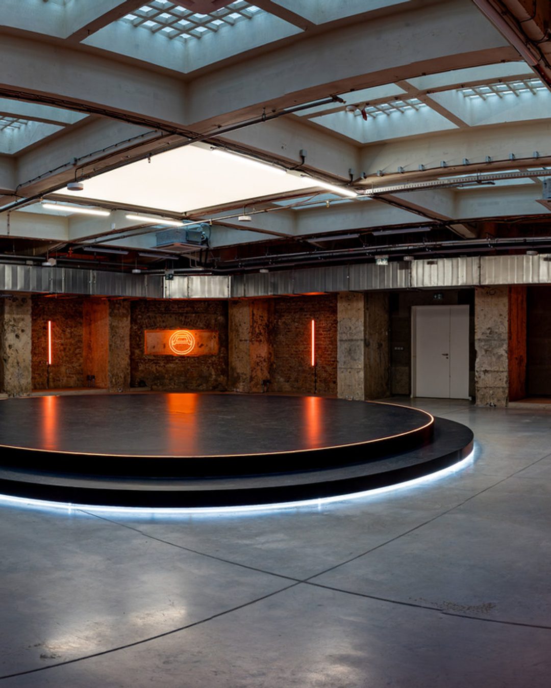 The round stage on Mars, lit, under the skylights